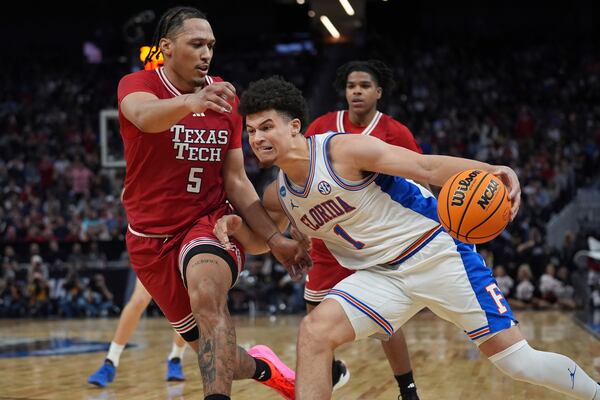Florida guard Walter Clayton Jr. (1) drives on Texas Tech forward Darrion Williams (5) during the second half in the Elite Eight of the NCAA college basketball tournament, Saturday, March 29, 2025, in San Francisco. (AP Photo/Marcio Jose Sanchez)