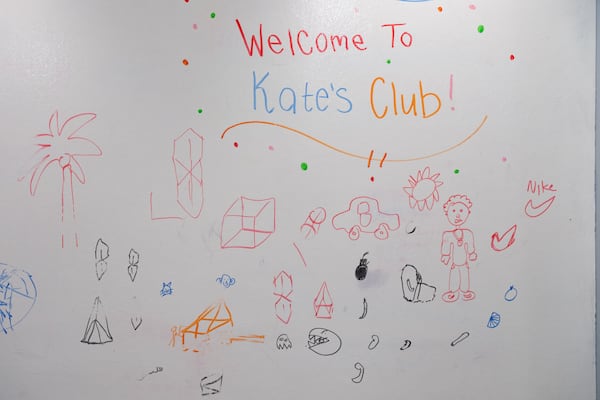 Children in the program have doodled on the whiteboard at Kate’s Club in Brookhaven. (Ben Gray for the AJC)