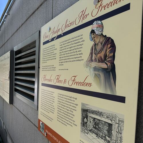 Visitors view the reinstalled educational panels about slavery at the site of President George Washington's home in Philadelphia, Wednesday, July 15, 2026. (AP Photo/Tassanee Vejpongsa)