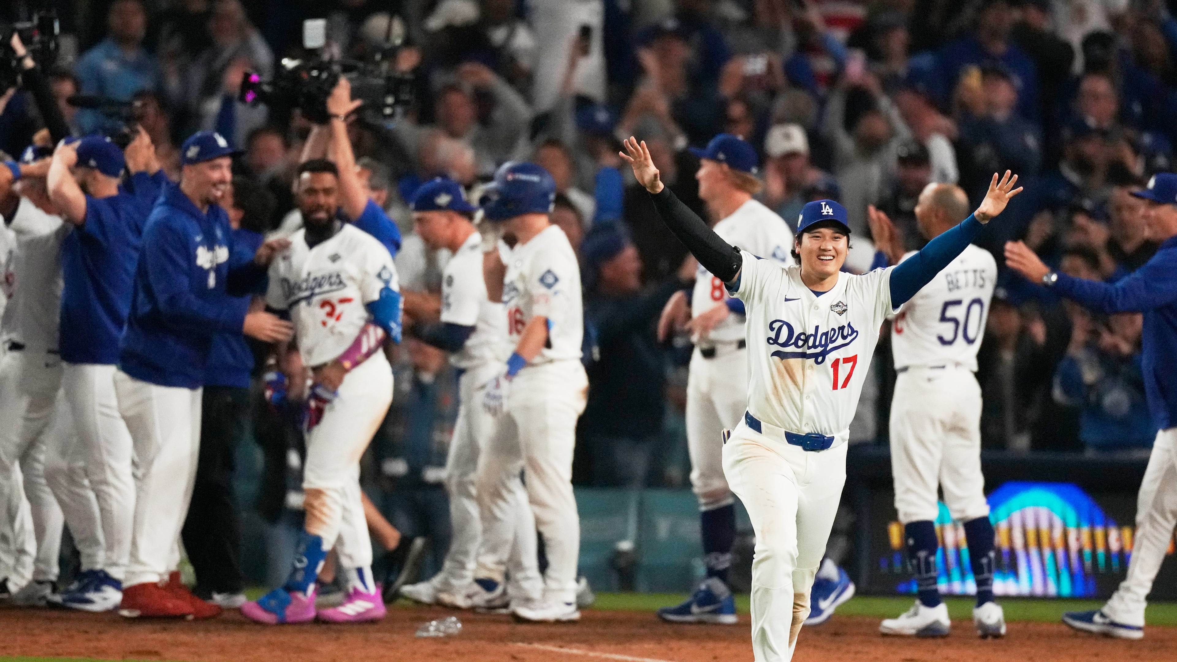 Los Angeles Dodgers' Shohei Ohtani celebrates their win against the Toronto Blue Jays during the 18th inning in Game 3 of baseball's World Series, Monday, Oct. 27, 2025, in Los Angeles. (AP Photo/Mark J. Terrill)