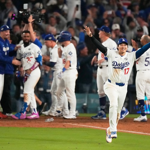 Los Angeles Dodgers' Shohei Ohtani celebrates their win against the Toronto Blue Jays during the 18th inning in Game 3 of baseball's World Series, Monday, Oct. 27, 2025, in Los Angeles. (AP Photo/Mark J. Terrill)