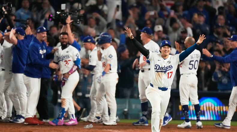 Los Angeles Dodgers' Shohei Ohtani celebrates their win against the Toronto Blue Jays during the 18th inning in Game 3 of baseball's World Series, Monday, Oct. 27, 2025, in Los Angeles. (AP Photo/Mark J. Terrill)