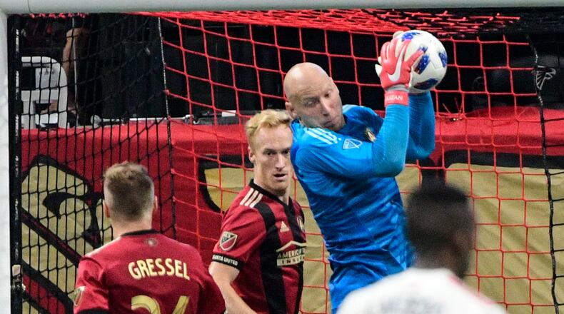 Atlanta United goalkeeper Brad Guzan makes a save during the second half of an MLS soccer game against the New England Revolution, Saturday, Oct. 6, 2018. (John Amis)