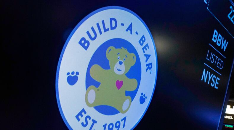 FILE - The logo for Build-A-Bear Workshop appears above a trading post on the floor of the New York Stock Exchange, Dec. 1, 2021. (AP Photo/Richard Drew, File)
