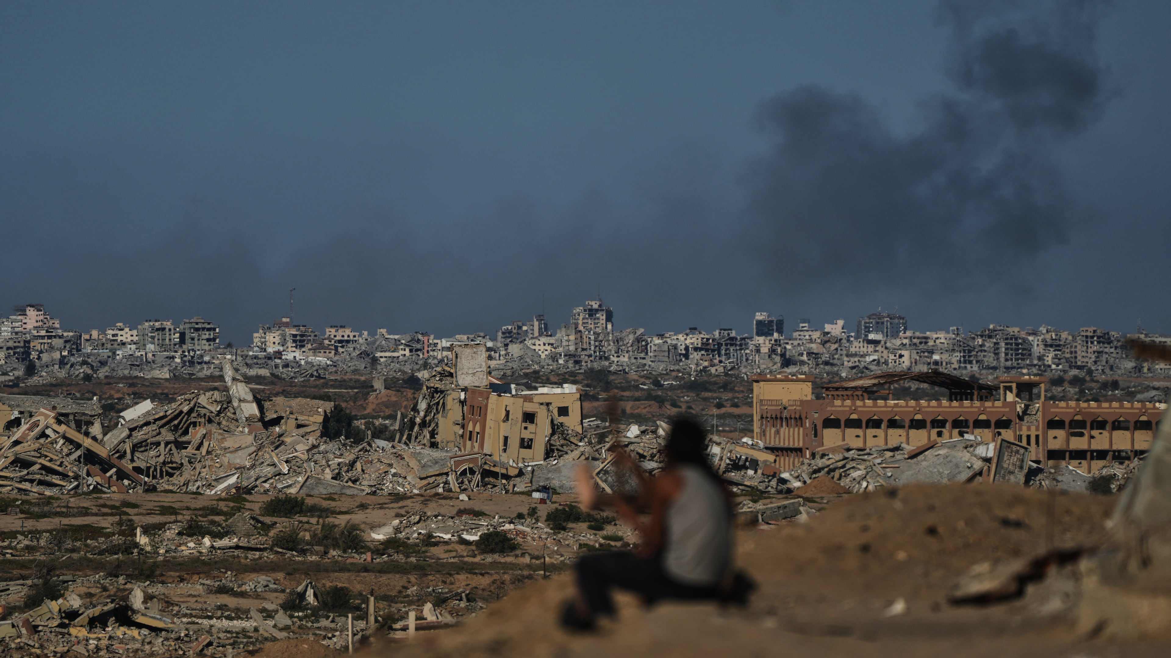 Smoke rises following an Israeli military strike in Gaza City, as seen from the central Gaza Strip, Tuesday, Oct. 7, 2025. (AP Photo/Abdel Kareem Hana)