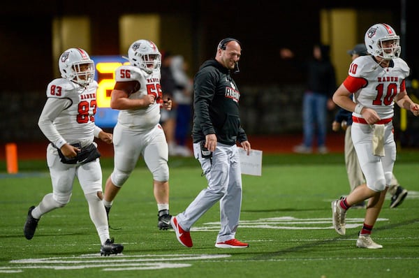 Rabun County head coach Jaybo Shaw is all smiles as he walks off the field following a 63-17 victory over Pope. Shaw’s father, Lee Shaw, is one of the top 100 winningest coaches in Georgia high school history. (Daniel Varnado for the AJC 2020)
