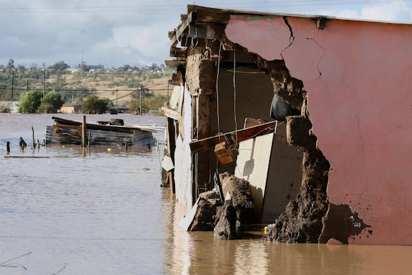 A view of homes submerged in floodwater, in Mthatha, South Africa, Tuesday, June 10, 2025. (AP Photo/Hoseya Jubase)