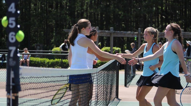 Chamblee's team of Madeline Meer and Madison Trinh shake hands with Strr's Mills' Carolina Kingsley and Megan Fox.