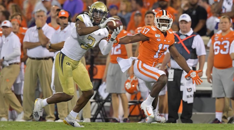 Georgia Tech defensive back Tre Swilling (3) intercepts a pass intended for Clemson wide receiver Cornell Powell (17)  at Memorial Stadium in Clemson, S.C. on Thursday, August 29, 2019. (Hyosub Shin / Hyosub.Shin@ajc.com)