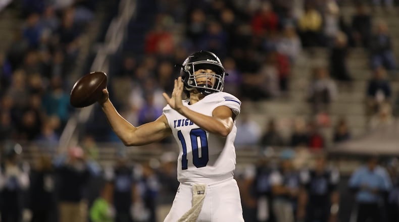 Centennial quarterback Max Brosmer (10) attempts a pass in the second half against Pope at Pope High School Friday, October 27, 2017, in Marietta, Ga. Centennial won 45-17. PHOTO / JASON GETZ