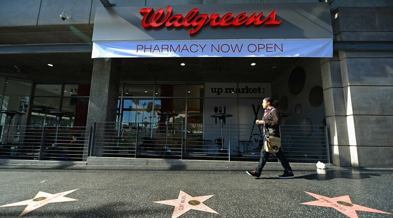 A woman walk past a Walgreens flagship store at the corner of Sunset and Vine in Hollywood, California, on January 15, 2013. The store was the scene Dec. 2, 2018, of the fatal shooting of Jonathan Hart, 21, an unarmed homeless man, by security guard Donald Vincent Ciota II, who suspected Hart of shoplifting. Ciota, 28, of Covina, has been charged with murder in Hart's death.