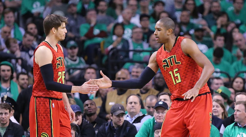 Hawks’ Kyle Korver gives Al Horford five on a defensive stop against the Celtics during the third period in Game 6 of an NBA basketball first-round playoff series at TD Garden on Thursday, April 28, 2016, in Boston. Curtis Compton / ccompton@ajc.com