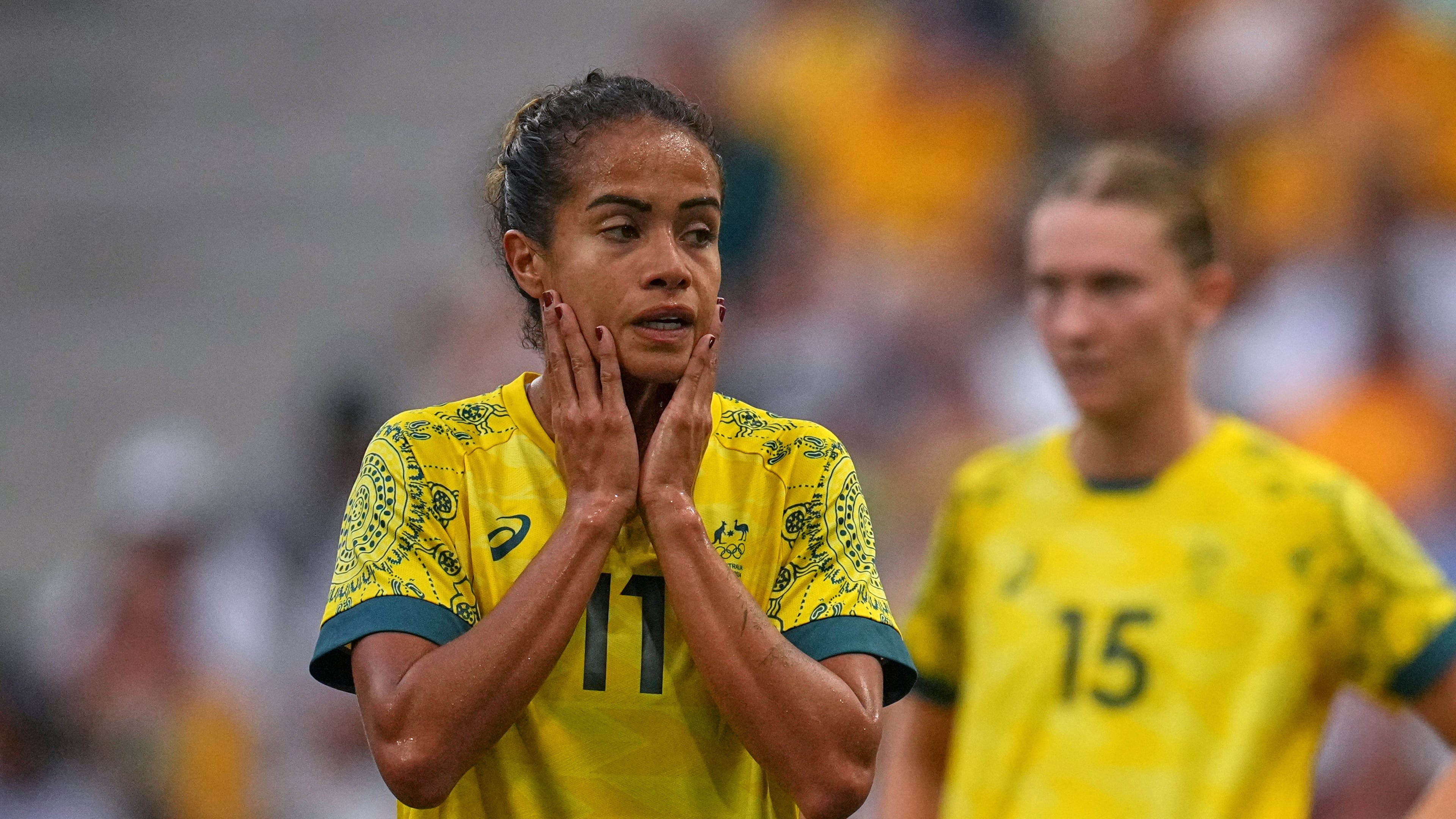 FILE - Australia's Mary Fowler, left, reacts during a women's Group B soccer match between Australia and the United States, at the Marseille Stadium, at the 2024 Summer Olympics, July 31, 2024, in Marseille, France. (AP Photo/Daniel Cole, file)