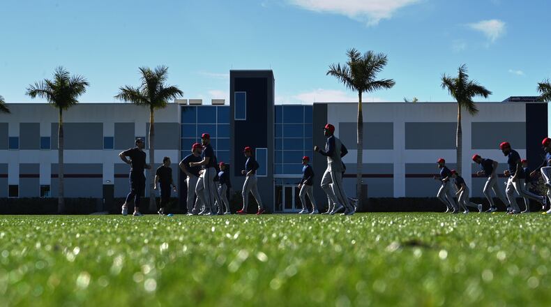 Atlanta Braves pitchers warm up during spring training baseball workouts at CoolToday Park, Wednesday, February, 14, 2024, in North Port, Florida. (Hyosub Shin / Hyosub.Shin@ajc.com)