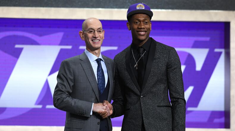 De'Andre Hunter poses with NBA Commissioner Adam Silver after being drafted with the fourth overall pick by the Los Angeles Lakers during the 2019 NBA Draft at the Barclays Center on June 20, 2019 in the Brooklyn borough of New York City. NOTE TO USER: User expressly acknowledges and agrees that, by downloading and or using this photograph, User is consenting to the terms and conditions of the Getty Images License Agreement. (Photo by Sarah Stier/Getty Images)