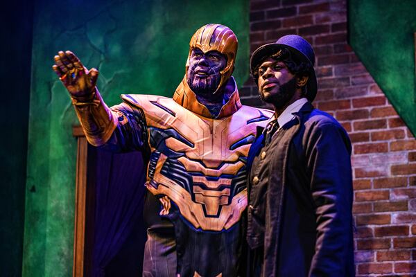 "Invasion: Christmas Carol" is the cheeky version of the Dickens classic  presented every holiday season by Dad's Garage Theatre. In this alternate universe, a strange character (unknown to the players) enters the action and the rest of the cast must improvise around the invader. Here, Thanos, the destroyer from the Marvel Universe of "The Avengers," encounters Scrooge. Photo: Chelsea Patricia