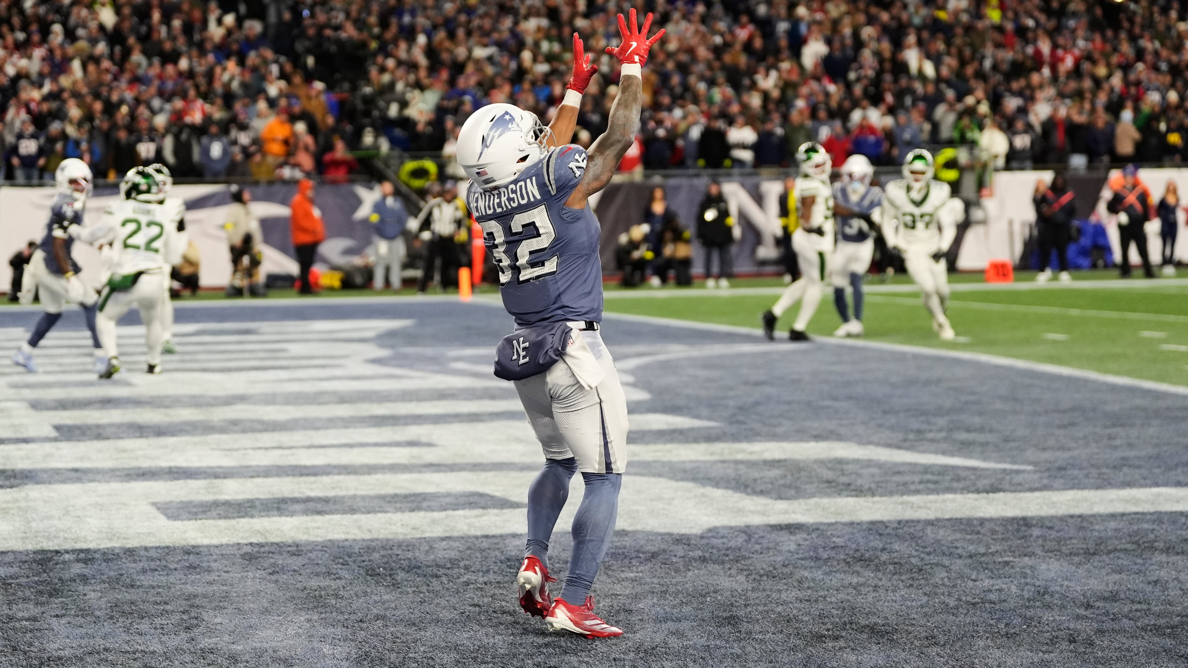 New England Patriots running back TreVeyon Henderson catches a touchdown pass during the second half of an NFL football game against the New York Jets, Thursday, Nov. 13, 2025, in Foxborough, Mass. (AP Photo/Charles Krupa)