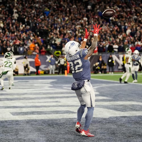 New England Patriots running back TreVeyon Henderson catches a touchdown pass during the second half of an NFL football game against the New York Jets, Thursday, Nov. 13, 2025, in Foxborough, Mass. (AP Photo/Charles Krupa)