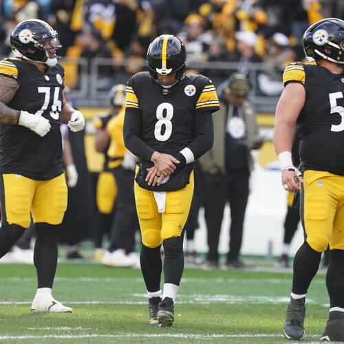 Pittsburgh Steelers quarterback Aaron Rodgers (8) holds his arm after a hit by the Cincinnati Bengals during the first half of an NFL football game Sunday, Nov. 16, 2025, in Pittsburgh. (AP Photo/Matt Freed)