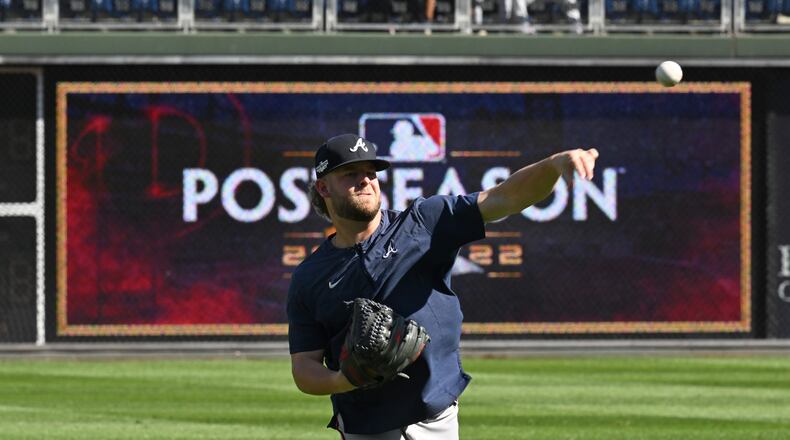 Braves pitcher A.J. Minter throws a ball before Game 4 of the 2022 National League Division Series Championship at Citizens Bank Park in Philadelphia on Saturday, October 15, 2022. (Hyosub Shin / Hyosub.Shin@ajc.com)