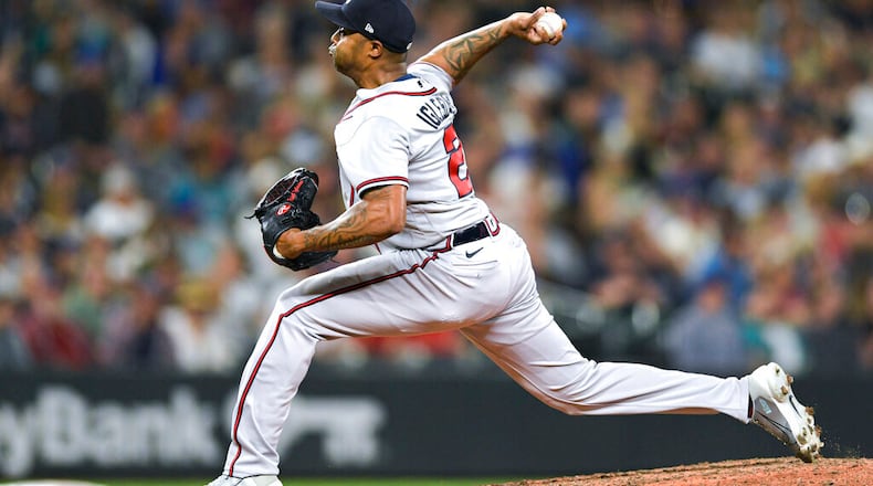 Braves reliever Raisel Iglesias throws to a Mariners batter during the eighth inning Friday in Seattle. A trade that occurred minutes before the deadline changed Iglesias’ trajectory this season. (AP Photo/Caean Couto)