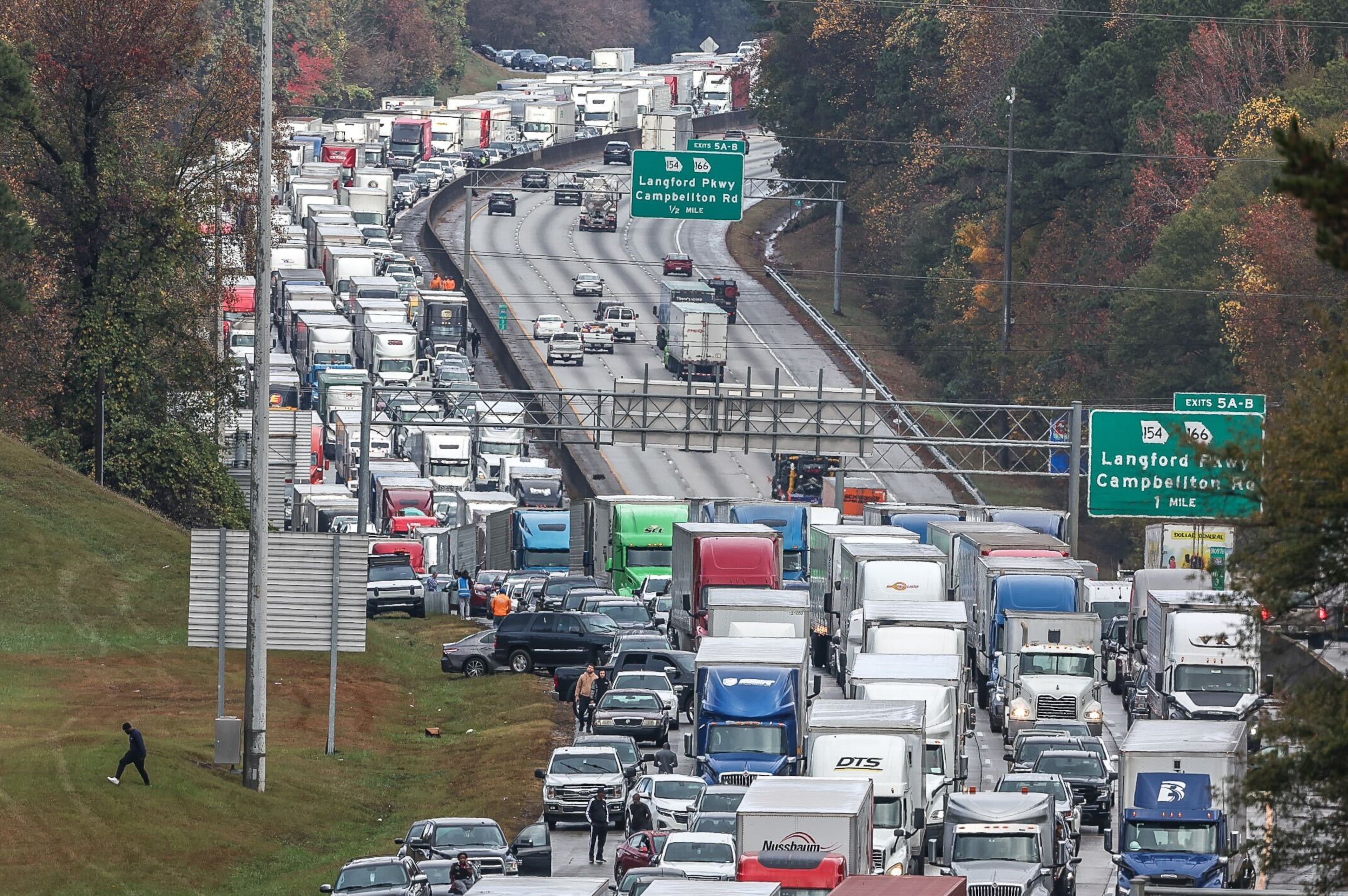 2 East Point officers hurt in I-285 crash near airport; traffic jammed for miles