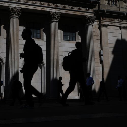 FILE -Pedestrians walk past the Bank of England in London, April 30, 2026. (AP Photo/Kirsty Wigglesworth, File)