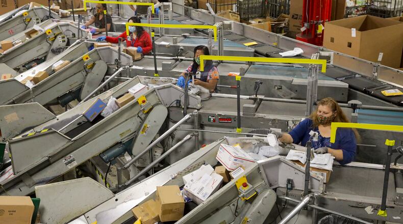 The Postal Service handled nearly 50% more packages between April and June than it did during the same period last year, the agency said. (Irfan Khan/Los Angeles Times/TNS)