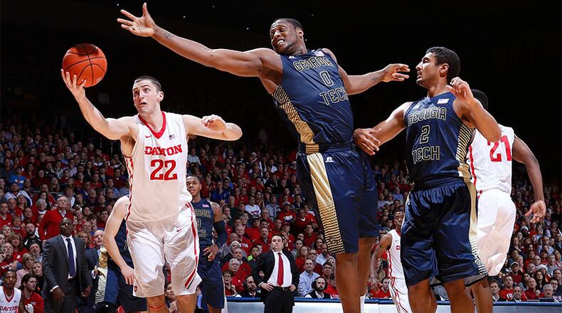 The Jackets' Charles Mitchell reaches for a rebound against Dayton's Bobby Wehrli (22) in the Flyers' 75-61 over Georgia Tech Tuesday in Dayton.