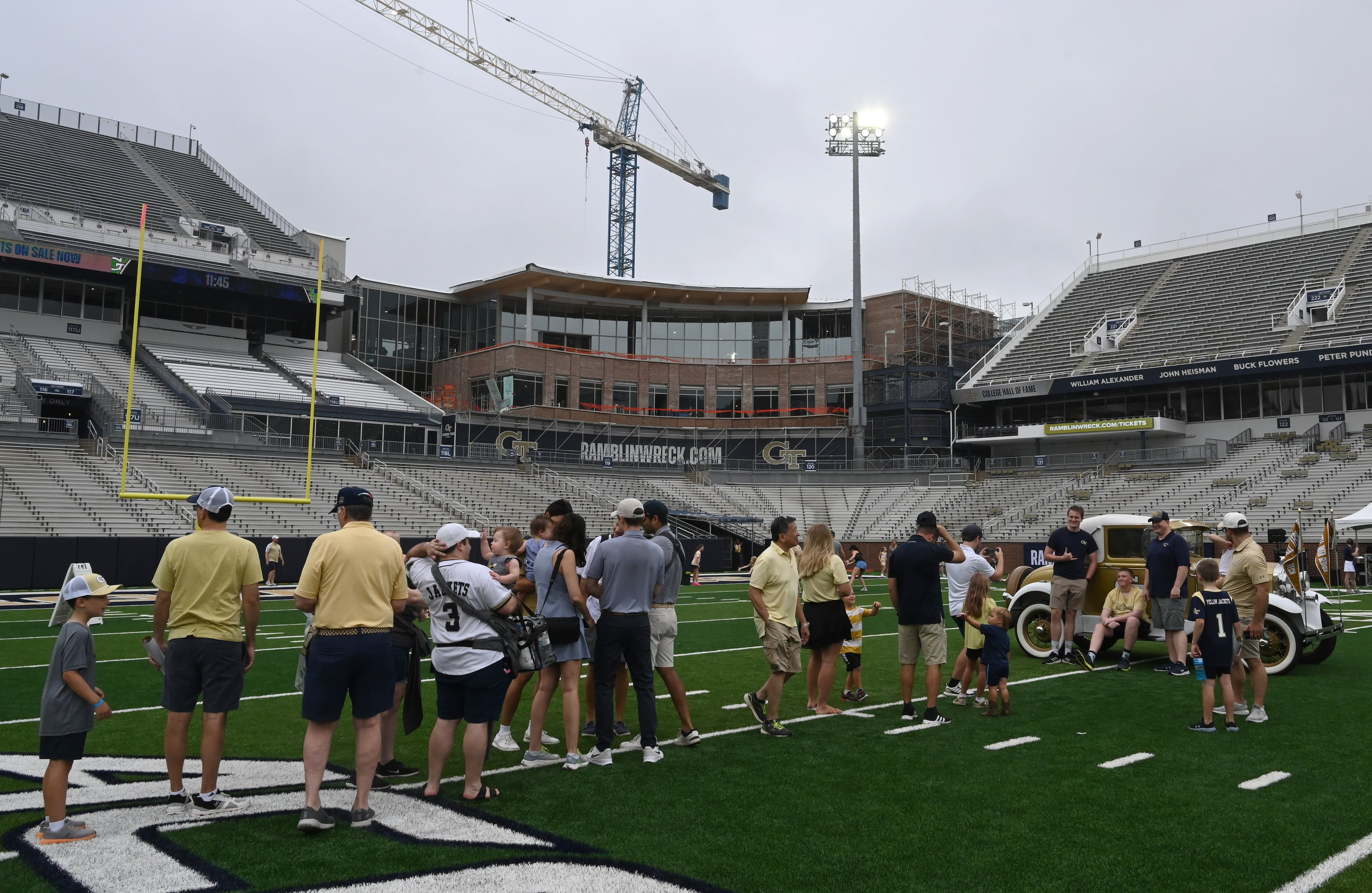 Attendees enjoy the annual “First Saturday on The Flats” at Bobby Dodd Stadium, Saturday, August 2, 2025, in Atlanta. The Flats allows Tech fans to engage with their favorite Yellow Jackets ahead of the upcoming 2025 season. The stadium is set to be renovated with some of the money raised. (Hyosub Shin/AJC)