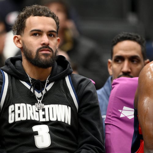 FILE - Washington Wizards guard Trae Young, center, looks on from the bench during the first half of an NBA basketball game against the Los Angeles Clippers, Jan. 19, 2026, in Washington. (AP Photo/Nick Wass, File)