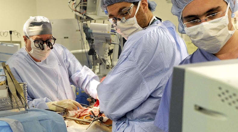Columbia University Medical Center Transplant Services surgeons watch a monitor as they perform a liver transplant at New York-Presbyterian Hospital in New York. (PHOTO by Keelin Daly/Hearst Connecticut Media via AP, File)