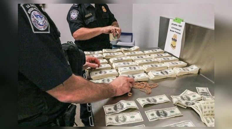 Federal authorities arrested a 62-year-old man accused of smuggling more than $500,000 in counterfeit money.