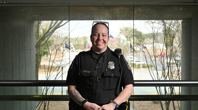 DeKalb County police Officer A. Cochran learned sign language from a childhood friend, a series of Google searches and library books.