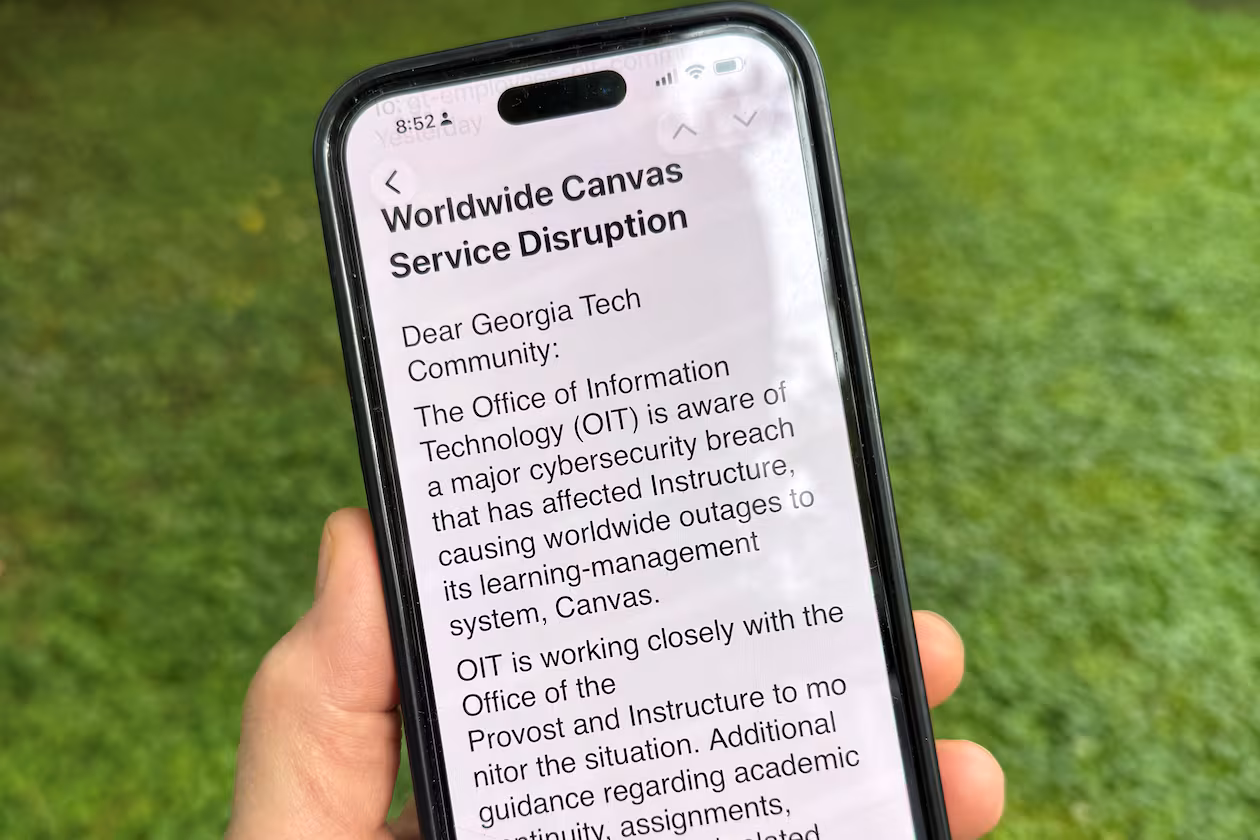 An image of a notice sent by Georgia Tech's information technology department warning students, professors and staff about the cybersecurity breach of the Canvas system it uses for assignments and grading is displayed on a phone, Friday, May 8, 2026, in Decatur, Georgia. (Michael Warren/AP)