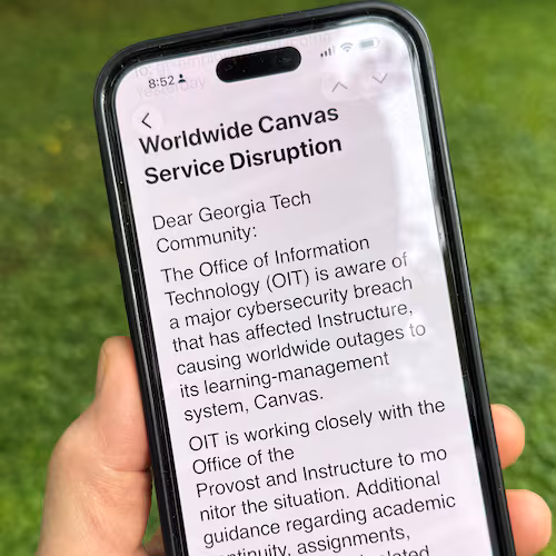 An image of a notice sent by Georgia Tech's information technology department warning students, professors and staff about the cybersecurity breach of the Canvas system it uses for assignments and grading is displayed on a phone, Friday, May 8, 2026, in Decatur, Georgia. (Michael Warren/AP)