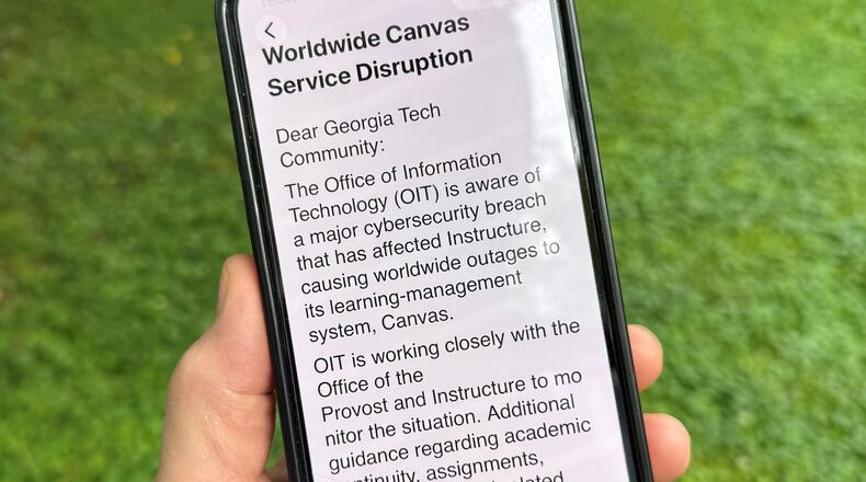 An image of a notice sent by Georgia Tech's information technology department warning students, professors and staff about the cybersecurity breach of the Canvas system it uses for assignments and grading is displayed on a phone, Friday, May 8, 2026, in Decatur, Georgia. (Michael Warren/AP)