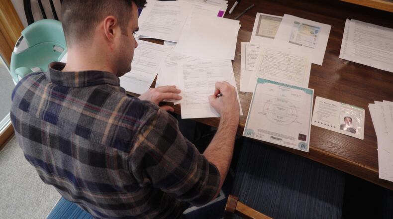 This image made from video shows Zach Loud completing his application for Canadian citizenship at his family's home in Farmington, Minn., April 17, 2026. (AP Photo/Mark Vancleave)
