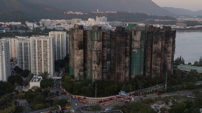 An aerial view of the burnt buildings after a deadly fire that started Wednesday at Wang Fuk Court, a residential estate in the Tai Po district of Hong Kong's New Territories, Friday, Nov. 28 2025. (AP Photo/Ng Han Guan)