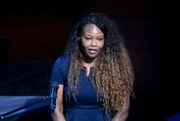 Marcye Scott, daughter of the late U.S. Rep. David Scott, speaks during his funeral service at Elizabeth Baptist Church earlier this month. (Hyosub Shin/AJC)