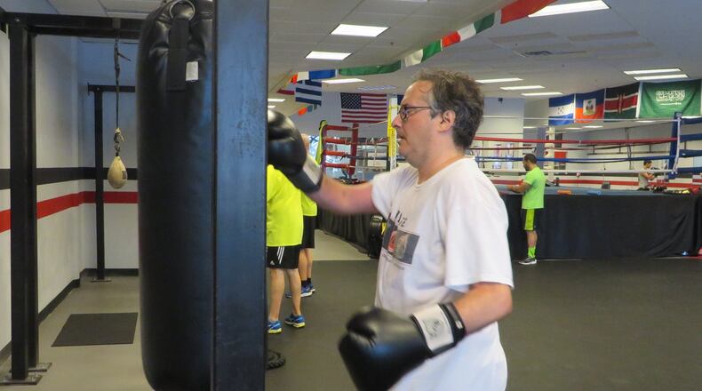 Larry Kahn, CEO of PD Gladiators, works out during a Wednesday boxing class at Delgado Boxing & Fitness gym, 6010-C Sandy Springs Circle, Atlanta, for people with early stages of Parkinson�s disease. Classes are also available for those in advanced stages of Parkinson�s. Kahn says research shows vigorous exercise, like boxing, helps improve the quality of life for those with Parkinson�s, and may also help slow progression of the disease. Photo contributed by Laura Berrios.