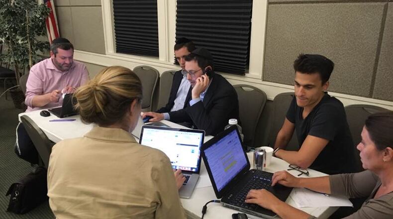 Metro Atlanta volunteers from the Orthodox Jewish community worked until midnight Wednesday matching hundreds of observant Jewish evacuees from Hurricane Irma with Toco Hill families to house them.