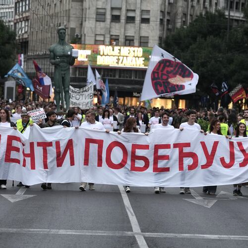 Political candidates, students and citizens carry signatures for the "Student list - Students win" to the Republic Election Commission towards participation in the upcoming parliamentary elections in Belgrade, Serbia, Monday, Sept. 14, 2026. (AP Photo/Darko Vojinovic)