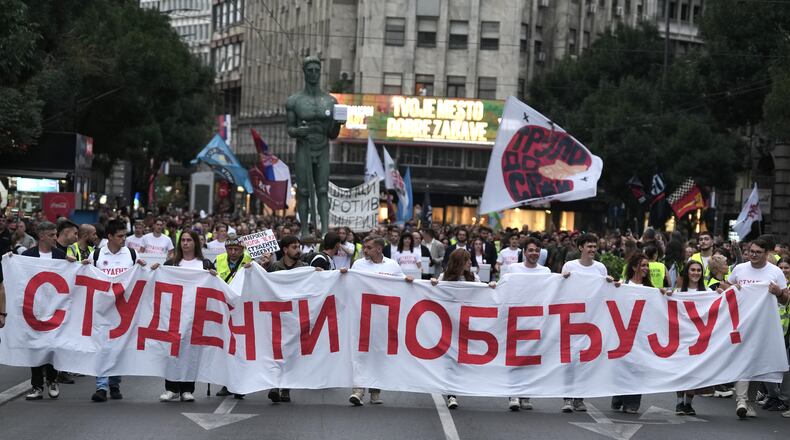 Political candidates, students and citizens carry signatures for the "Student list - Students win" to the Republic Election Commission towards participation in the upcoming parliamentary elections in Belgrade, Serbia, Monday, Sept. 14, 2026. (AP Photo/Darko Vojinovic)