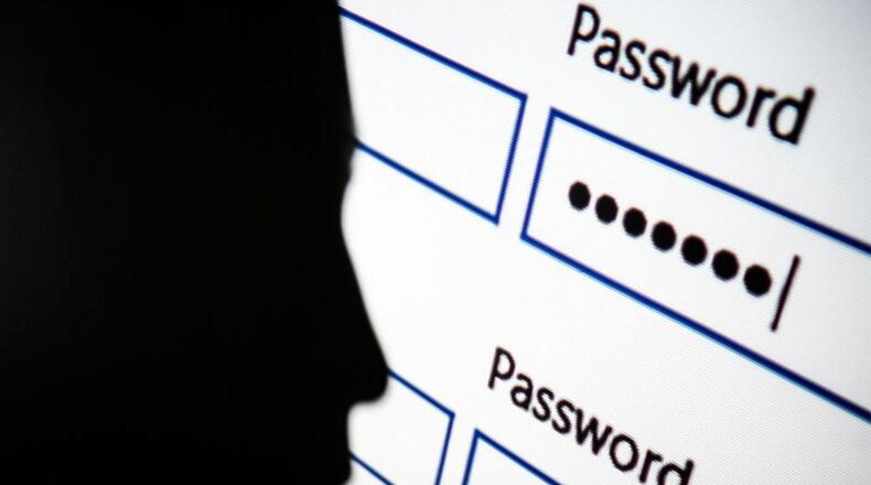 LONDON, ENGLAND - AUGUST 09: In this photo illustration, A woman is silhouetted against a projection of a password log-in dialog box on August 09, 2017 in London, England. With so many areas of modern life requiring identity verification, online security remains a constant concern, especially following the recent spate of global hacks. (Photo by Leon Neal/Getty Images)