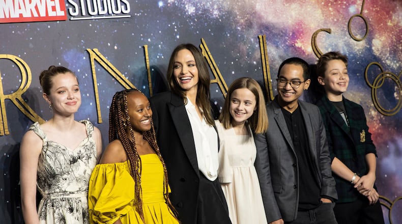 Angelina Jolie dropped off her daughter Zahara (second from left) at Spelman College in downtown Atlanta this week. In this photo, Shiloh Jolie-Pitt (from left), Zahara Jolie-Pitt, Angelina Jolie, Vivienne Jolie-Pitt, Maddox Jolie-Pitt and Knox Jolie-Pitt pose for photographers upon arrival at the premiere of the film "Eternals" on Wednesday, Oct. 27, 2021, in London. (Photo by Vianney Le Caer/Invision/AP)