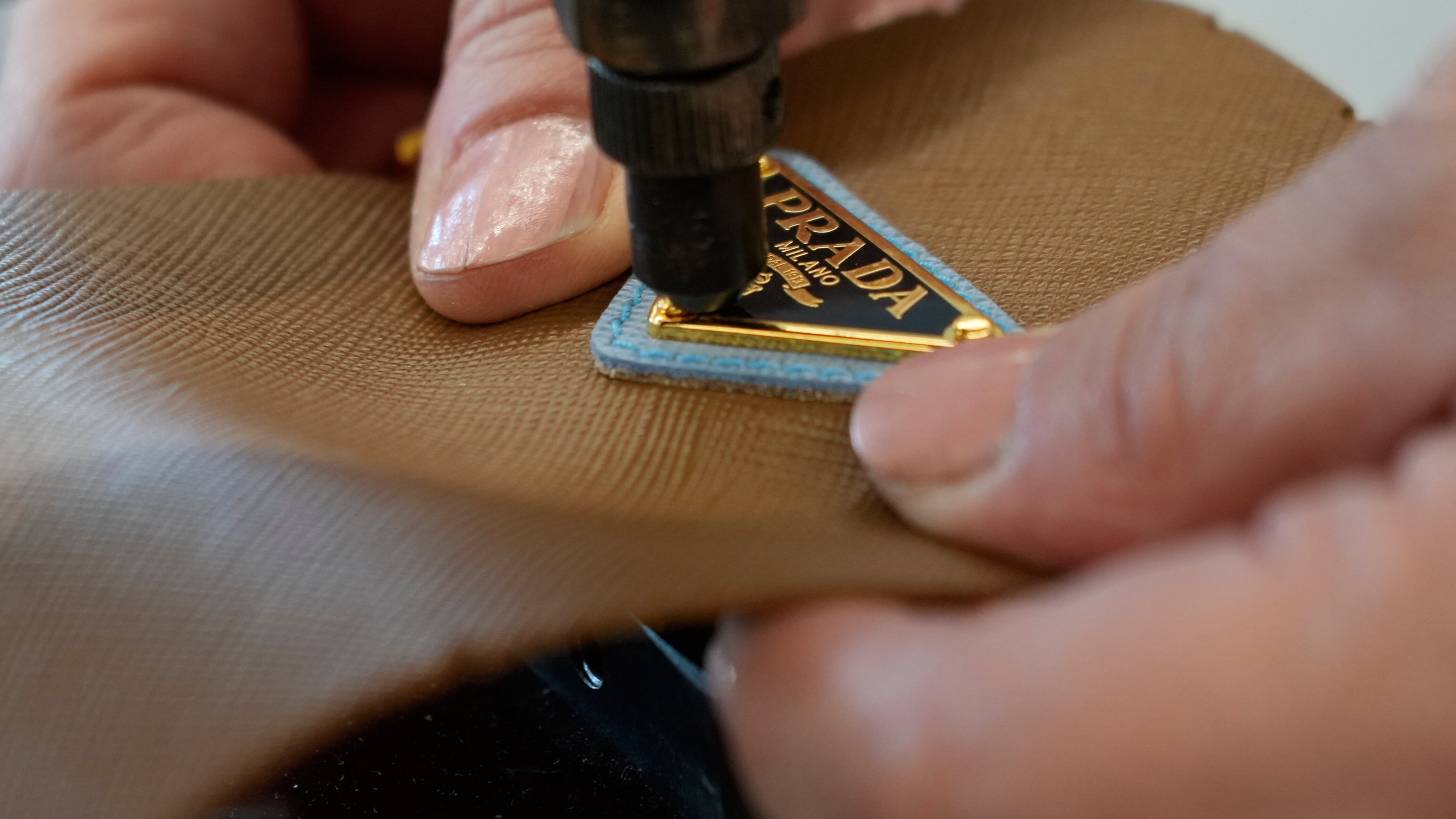 A leather good operator works at the Prada factory in Scandicci, Italy, Friday, Nov. 28, 2025. (AP Photo/Gregorio Borgia, File)