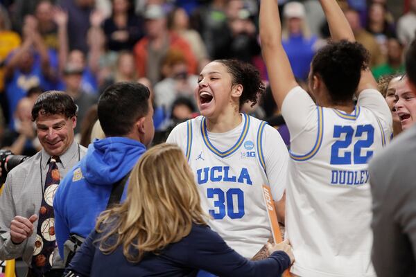 UCLA forward Timea Gardiner (30) celebrates the team's win against LSU in the Elite Eight of the NCAA college basketball tournament, Sunday, March 30, 2025, in Spokane, Wash. (AP Photo/Young Kwak)