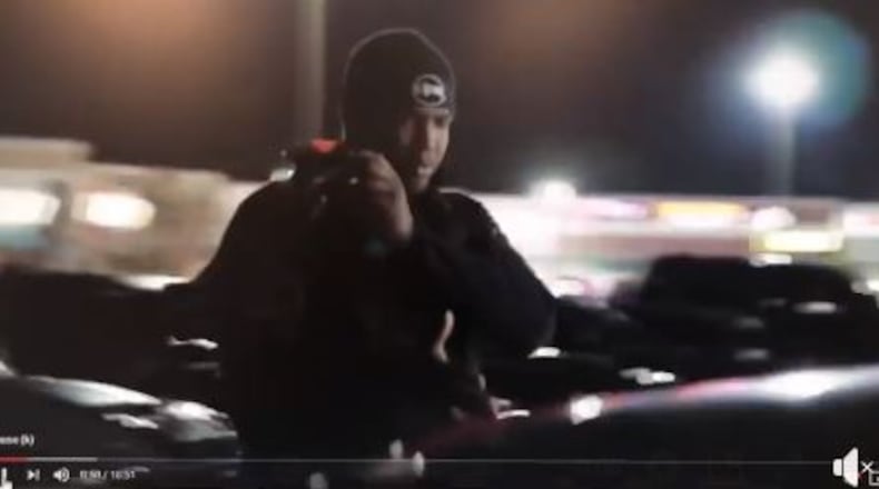 The man allegedly lit a firework and pointed it at a police car.