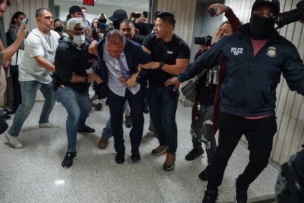New York City Comptroller Brad Lander is placed under arrest by Immigration and Customs Enforcement (ICE) and FBI agents outside federal immigration court on Tuesday, June 17, 2025, in New York. (AP Photo/Olga Fedorova)